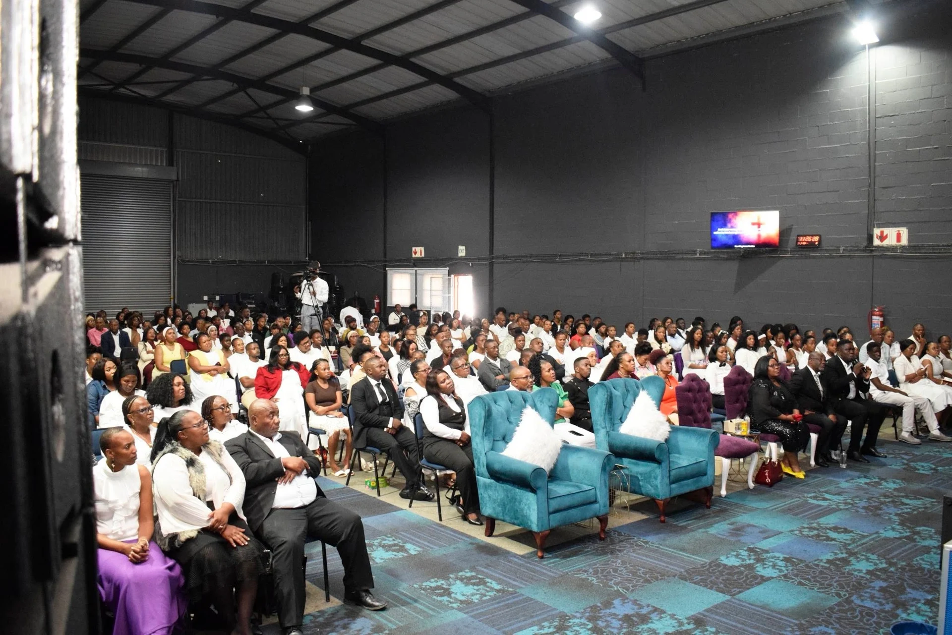 Inside Henosis Church during a Sunday service