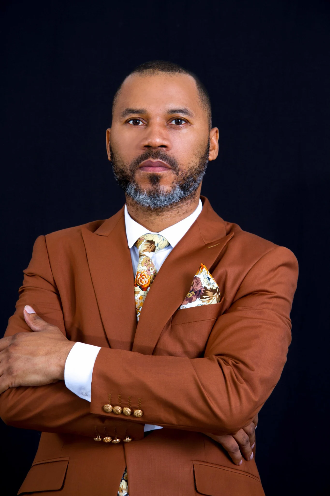 Bishop Fino Isaka in a brown suit