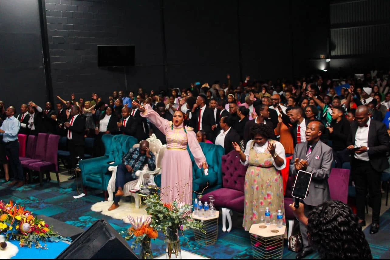 The Henosis Church community gathered in worship